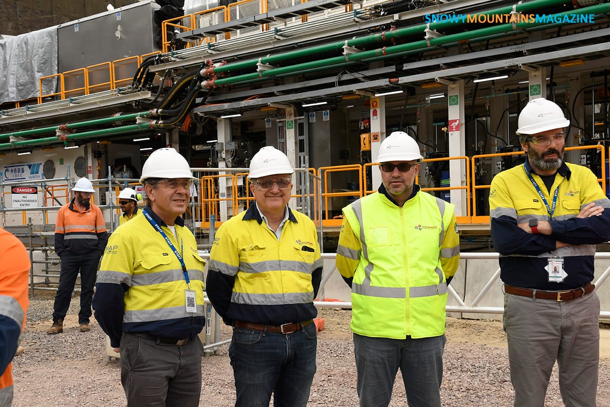 Future Generation staff are definable in yellow clothing, with the TBM structure behind. Snowy Hydro staff dress in orange.