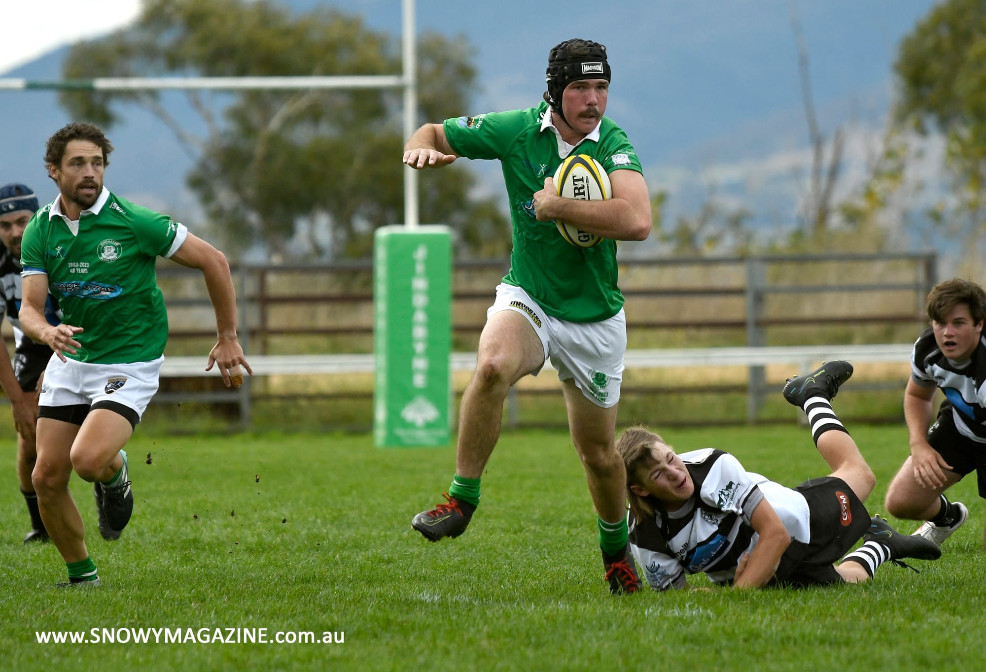 Finn Chatten breaking tackles on his way to scoring a solo effort try.