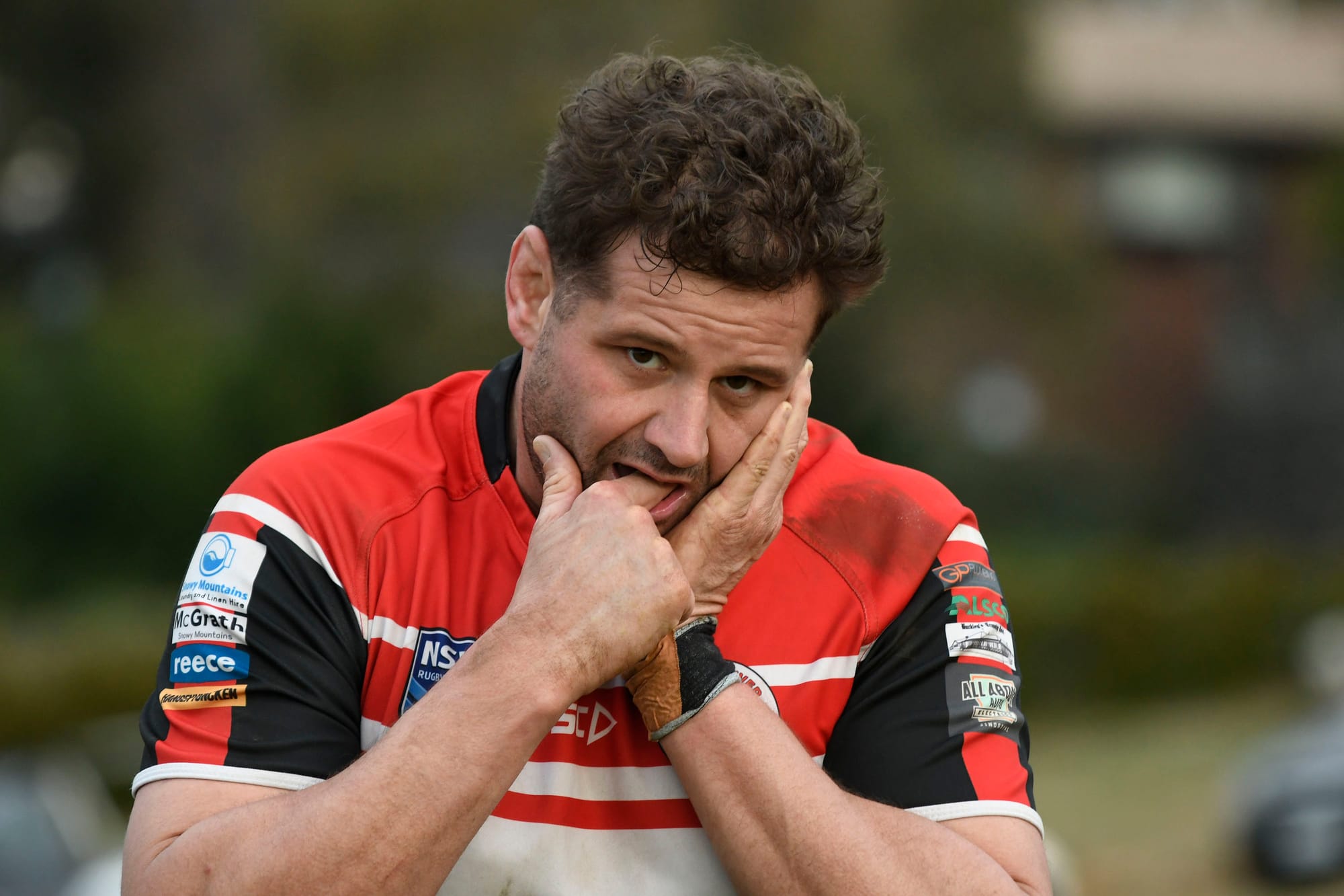 Josh Hitchens leaves the field with a fractured jaw.