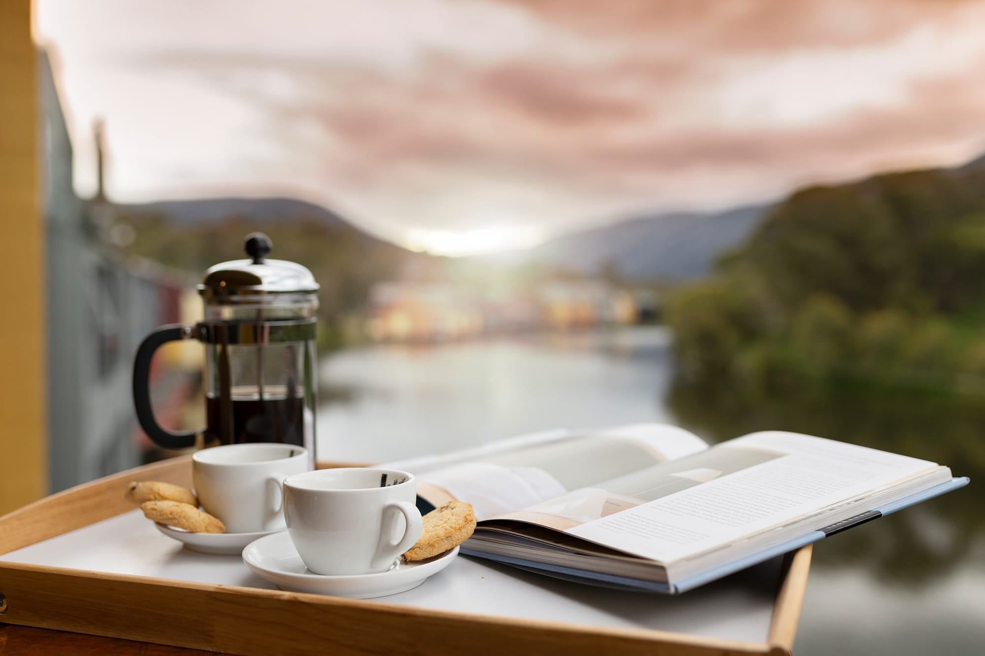 Relaxing in the lakeside apartments with coffee and a book.